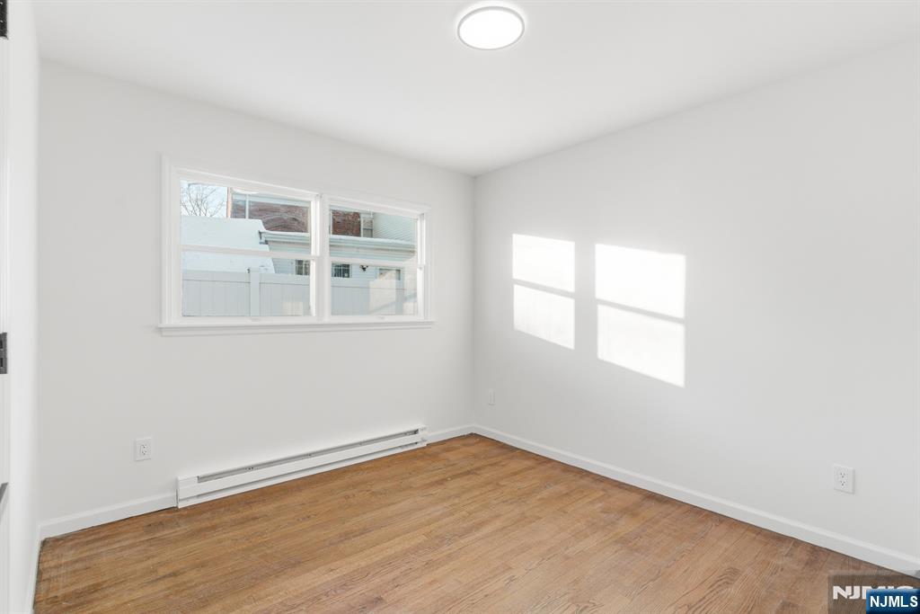 751 Hanson Avenue Perth Amboy, NJ 08861 - Photo 18 of 25 an empty room with a window