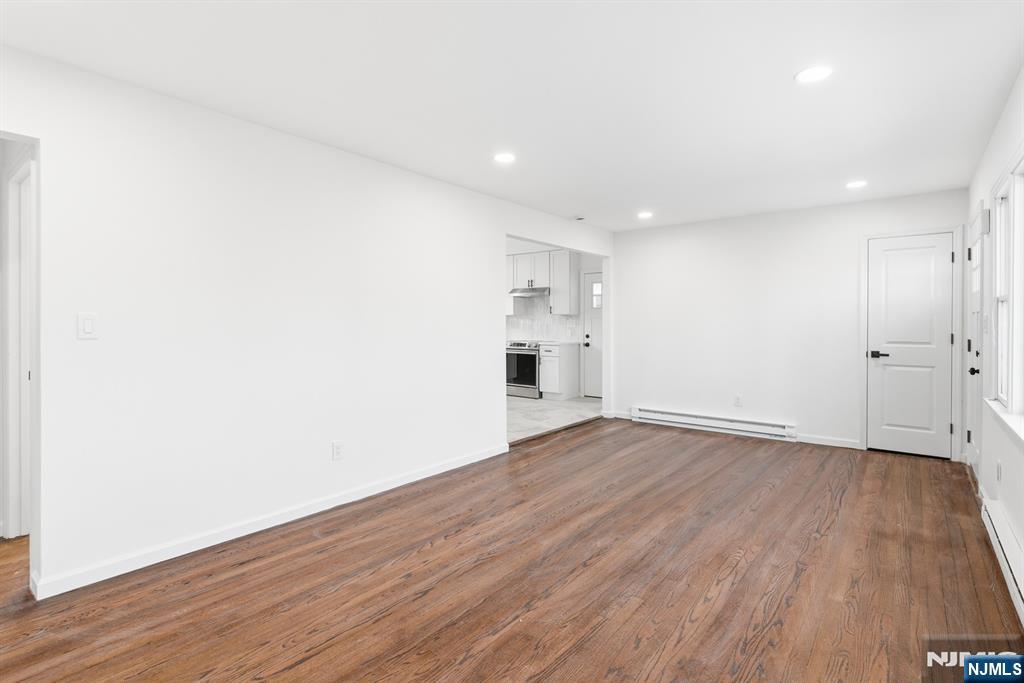 751 Hanson Avenue Perth Amboy, NJ 08861 - Photo 19 of 25 a view of empty room with wooden floor and window
