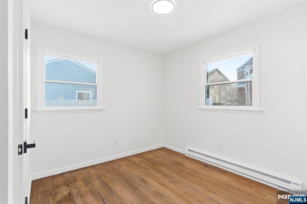 751 Hanson Avenue Perth Amboy, NJ 08861 - Photo 21 of 25 an empty room with a window