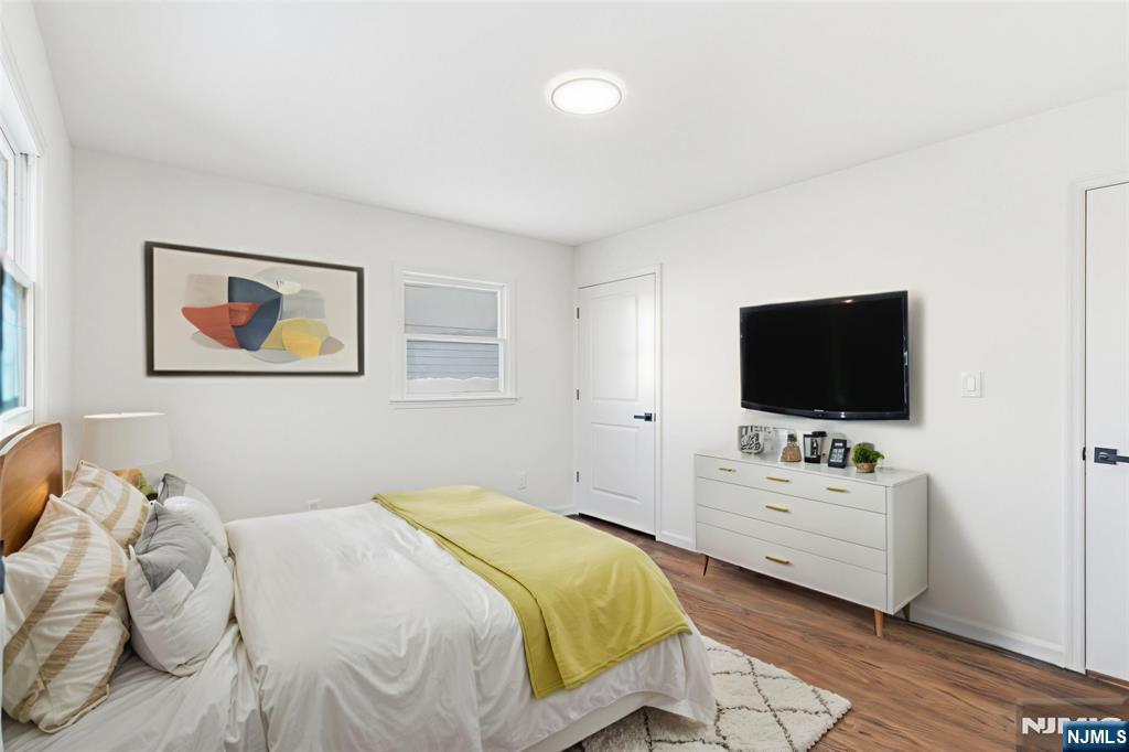 751 Hanson Avenue Perth Amboy, NJ 08861 - Photo 9 of 25 a bedroom with a bed and a flat screen tv