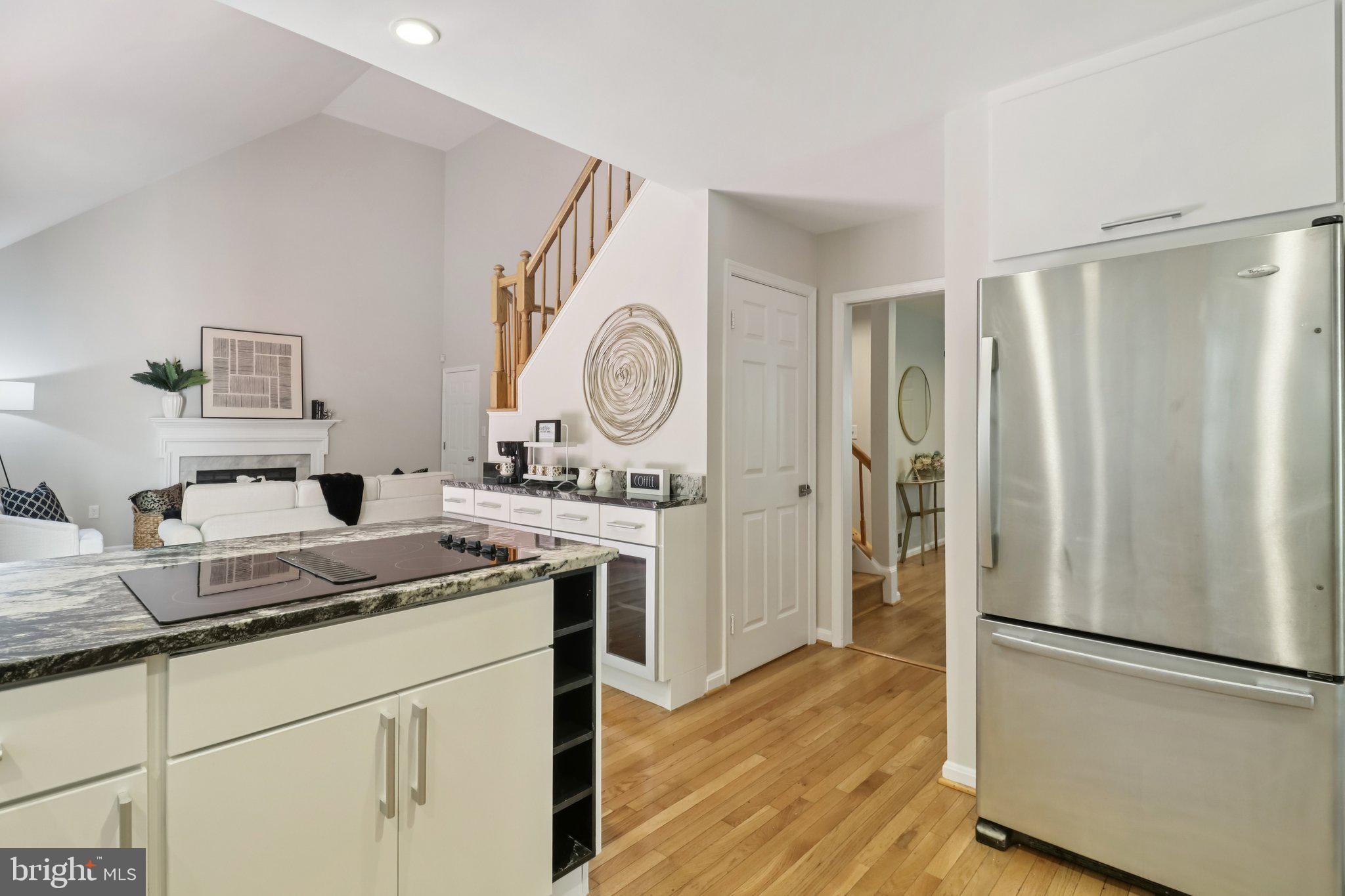13229 Osterport Drive Silver Spring, MD 20906 - Photo 12 of 40 a kitchen with a refrigerator sink and cabinets