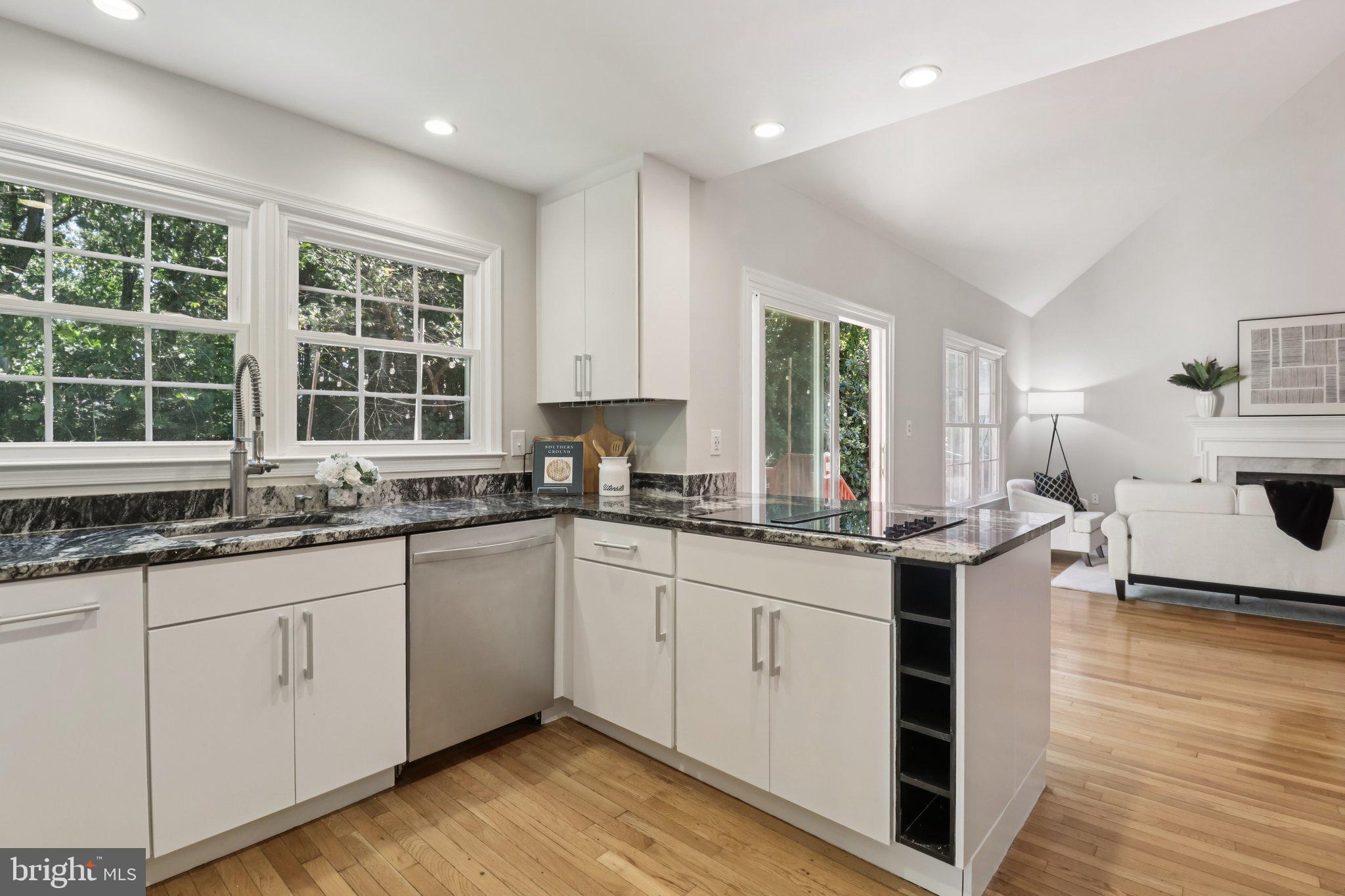 13229 Osterport Drive Silver Spring, MD 20906 - Photo 13 of 40 a kitchen with a sink cabinets and window