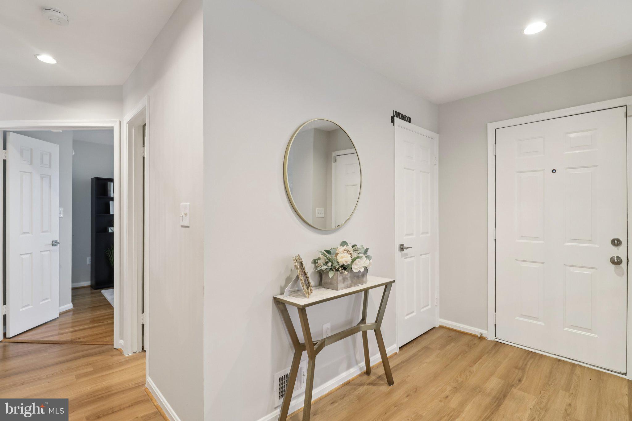 13229 Osterport Drive Silver Spring, MD 20906 - Photo 17 of 40 a view of a room with wooden floor mirror and entryway