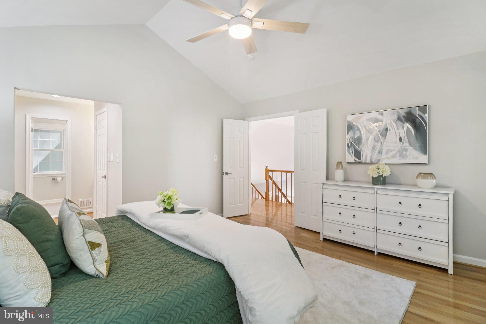 13229 Osterport Drive Silver Spring, MD 20906 - Photo 21 of 40 a bedroom with a bed and a dresser