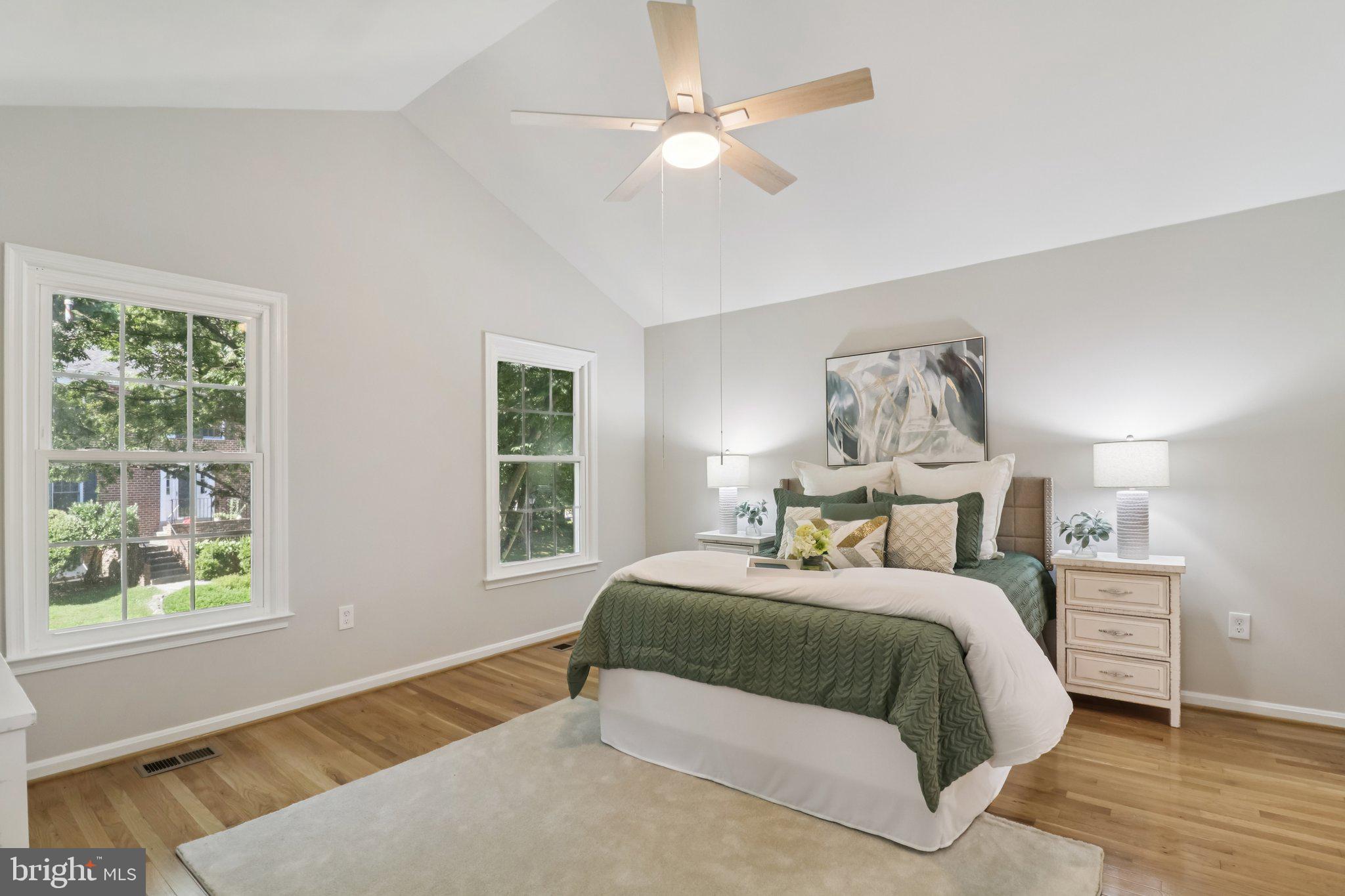 13229 Osterport Drive Silver Spring, MD 20906 - Photo 22 of 40 a bedroom with a large bed and a window