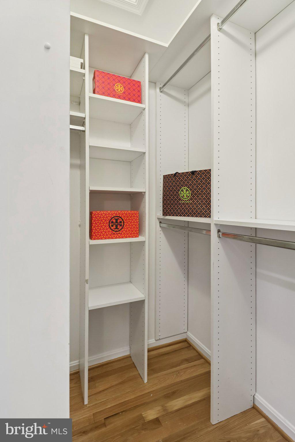 13229 Osterport Drive Silver Spring, MD 20906 - Photo 23 of 40 a room with walk in closet and wooden floor