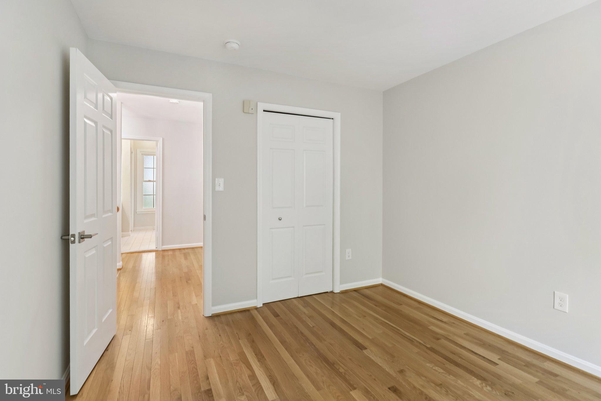 13229 Osterport Drive Silver Spring, MD 20906 - Photo 27 of 40 a view of empty room with wooden floor