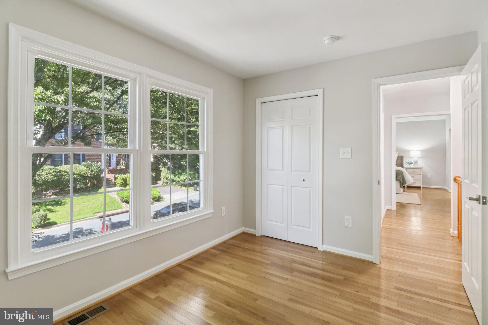 13229 Osterport Drive Silver Spring, MD 20906 - Photo 31 of 40 a view of empty room with wooden floor and fan