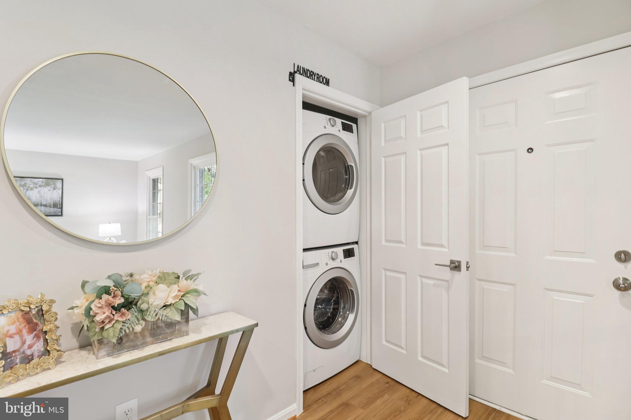 13229 Osterport Drive Silver Spring, MD 20906 - Photo 32 of 40 a view of a storage and utility room with washer and dryer