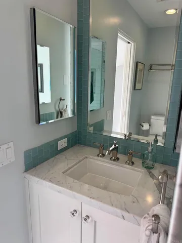 a bathroom with a shower and toilet