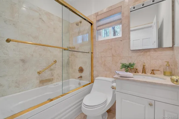 a bathroom with a sink a toilet and a bathtub