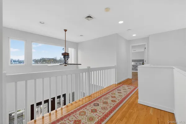 a view of a hallway with windows