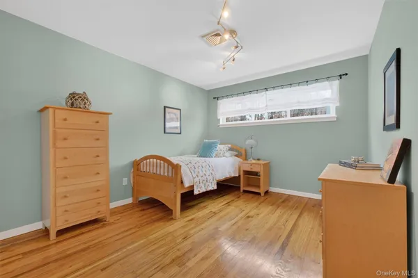 a bedroom with a bed and a desk