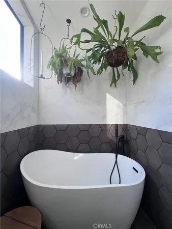 a white tub sitting in a bathroom