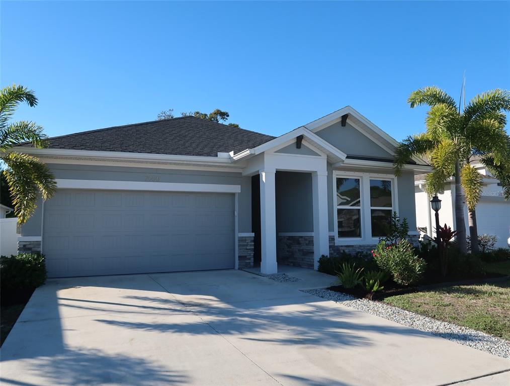 2555 Fireflag Lane Sarasota, FL 34232 - Photo 1 of 1 a view of house with yard and potted plants