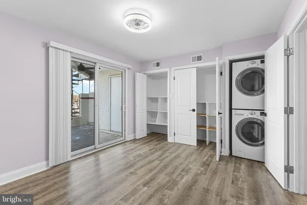 a view of a hallway with washer and dryer