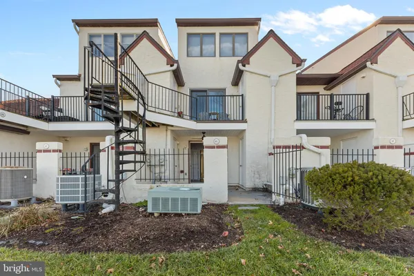 a view of a house next to a big yard