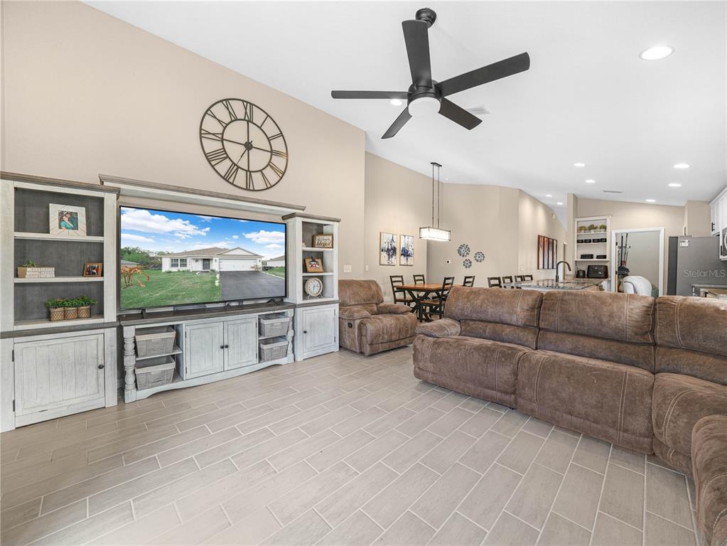 266 South Lake Avenue Frostproof, FL 33843 - Photo 16 of 42 a living room with furniture and a flat screen tv