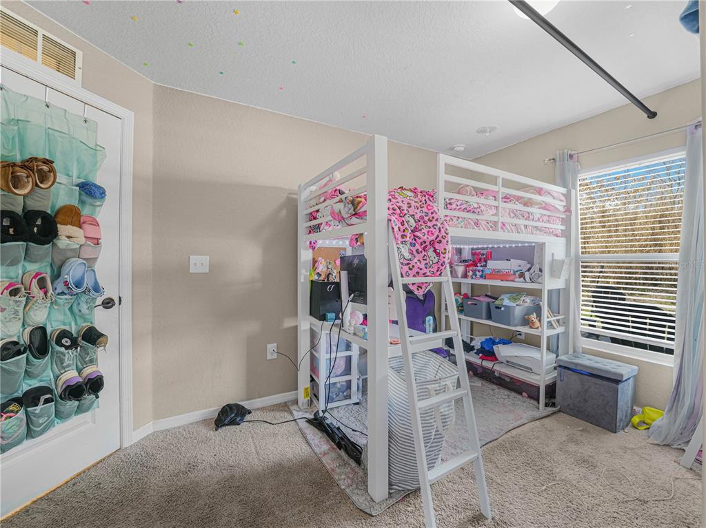 266 South Lake Avenue Frostproof, FL 33843 - Photo 22 of 42 a living room with furniture and a potted plant