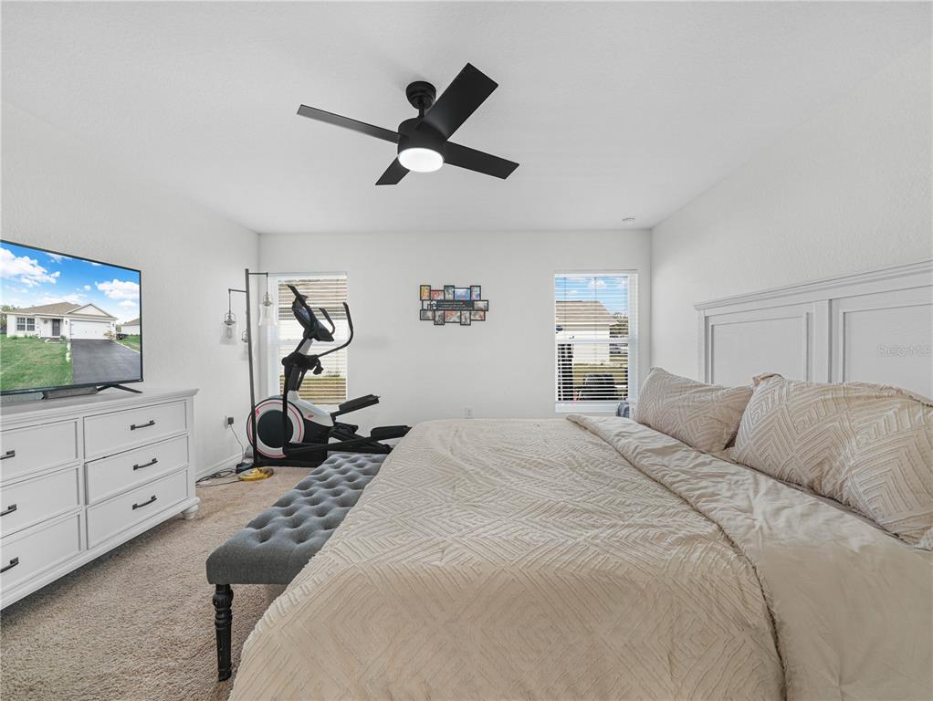 266 South Lake Avenue Frostproof, FL 33843 - Photo 27 of 42 a bedroom with a bed and a flat screen tv
