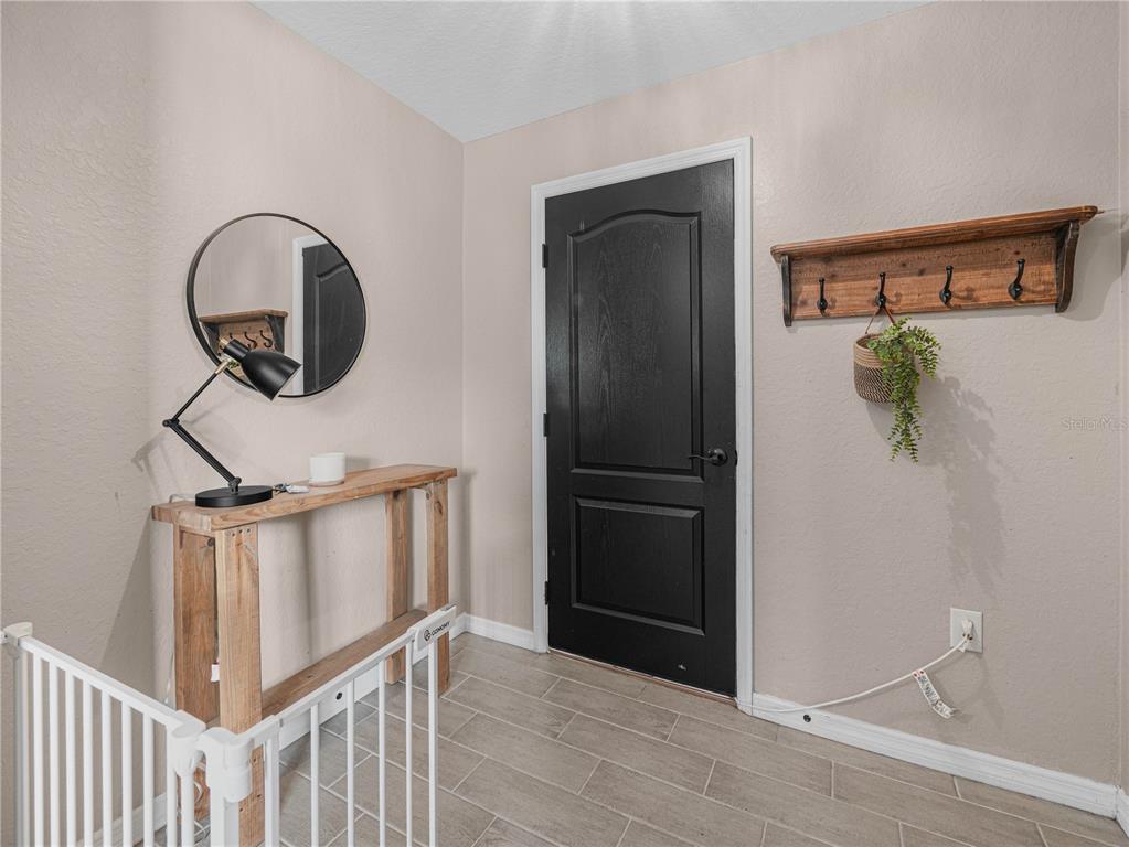 266 South Lake Avenue Frostproof, FL 33843 - Photo 4 of 42 a view of a hallway with entryway