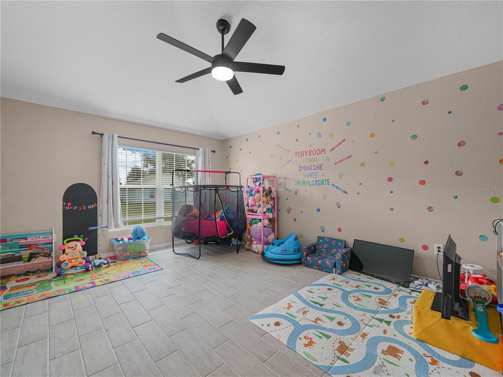 266 South Lake Avenue Frostproof, FL 33843 - Photo 6 of 42 a bed room with furniture and a window