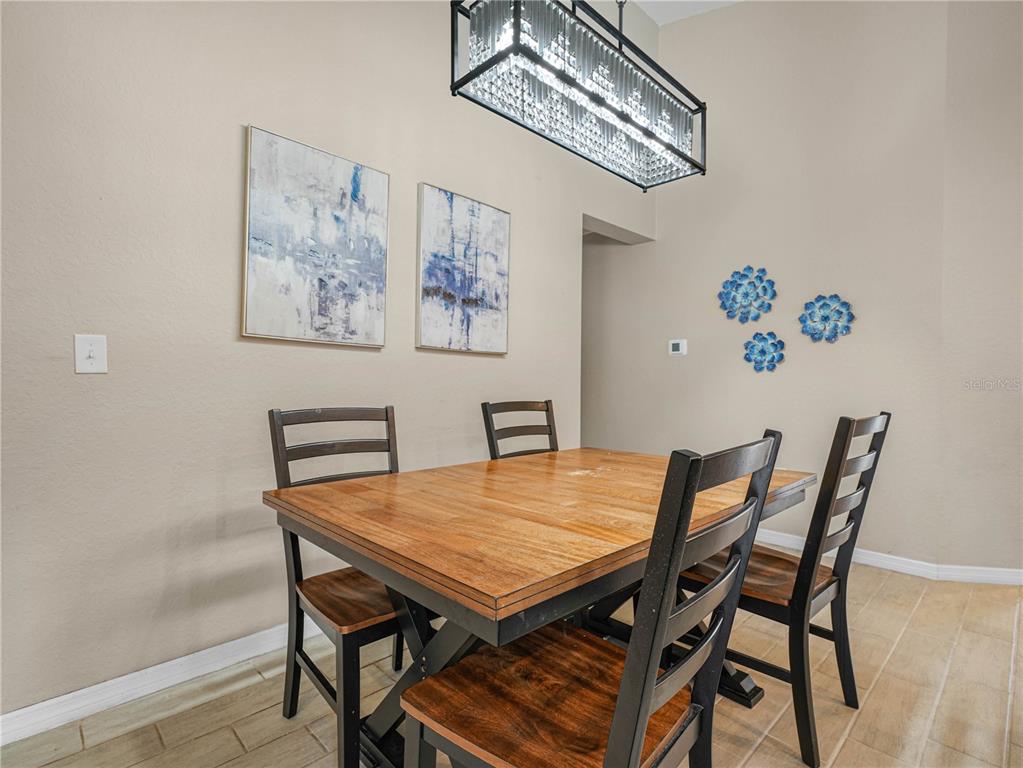 266 South Lake Avenue Frostproof, FL 33843 - Photo 10 of 42 a view of a dining room with furniture