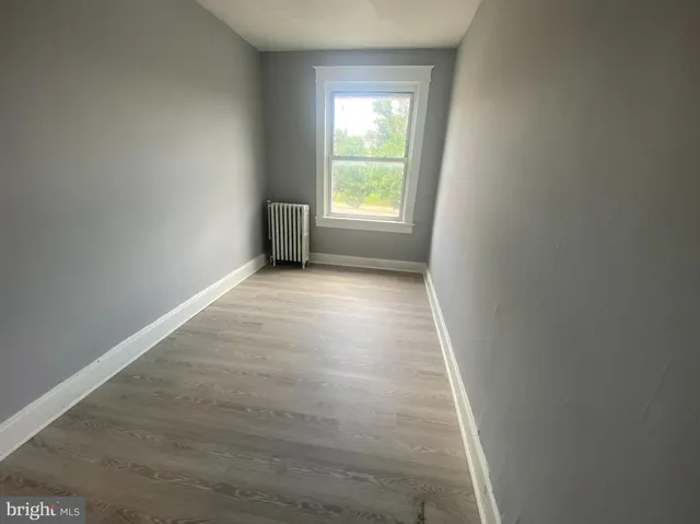 a view of an empty room and a window