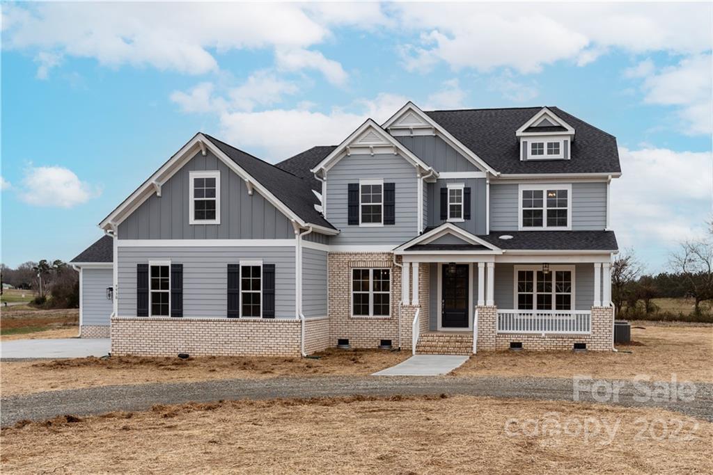 9930 Belt Road Midland, NC 28107 - Photo 1 of 2 a front view of a house with a yard