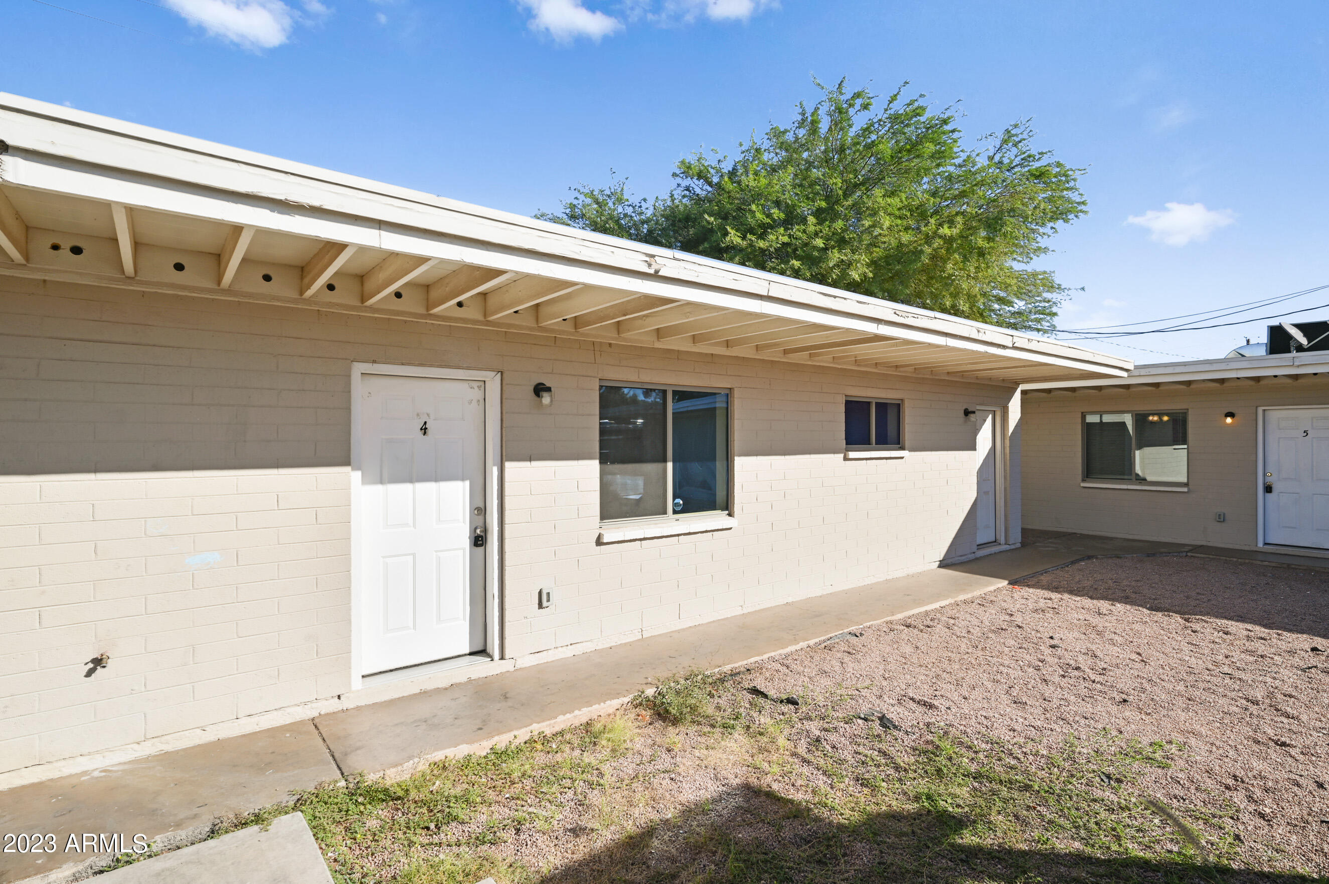 3949 East Earll Drive, Unit 4 Phoenix, AZ 85018 - Photo 1 of 11 a front view of a house