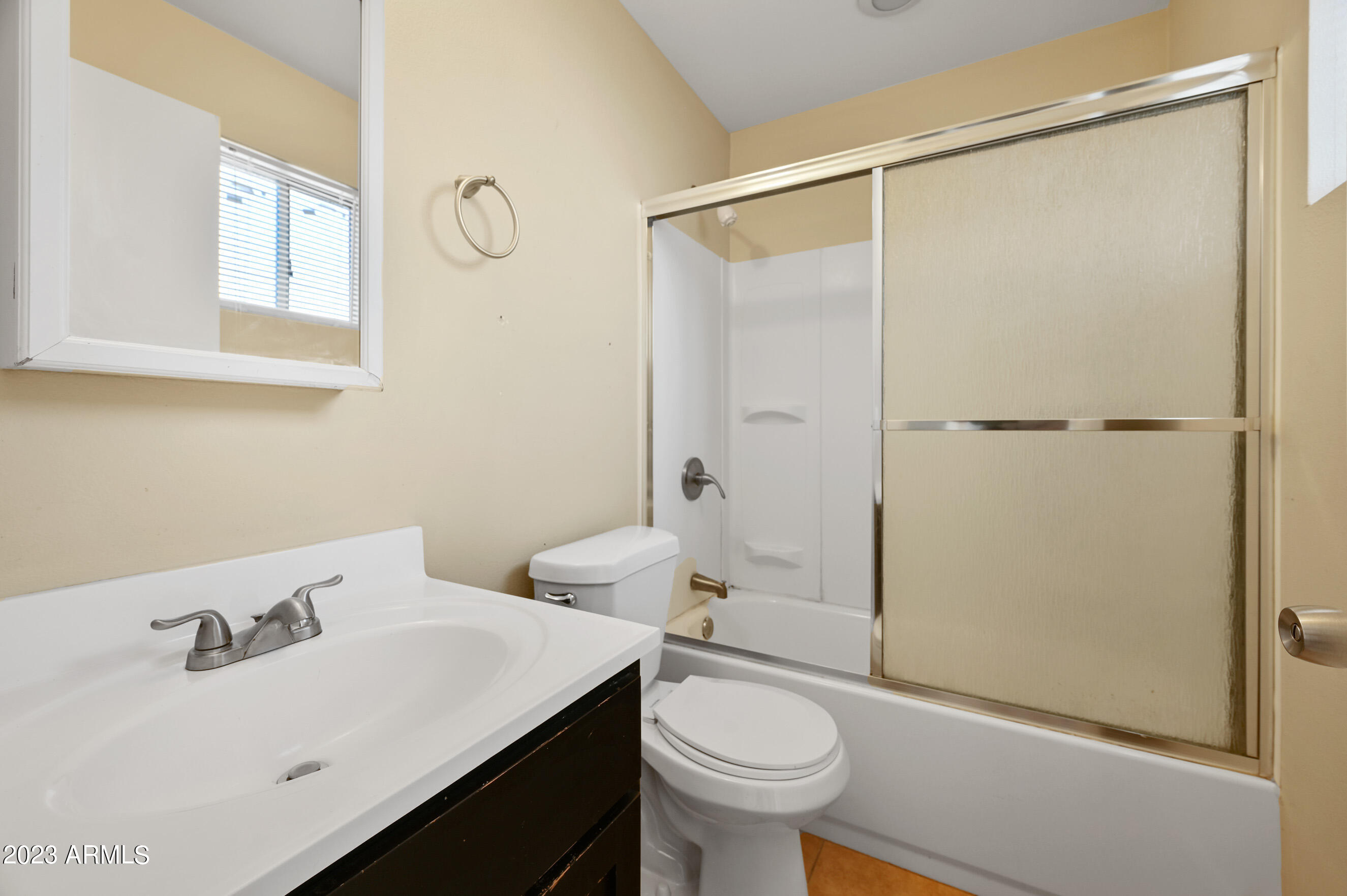 3949 East Earll Drive, Unit 4 Phoenix, AZ 85018 - Photo 11 of 11 a bathroom with a sink a toilet and shower