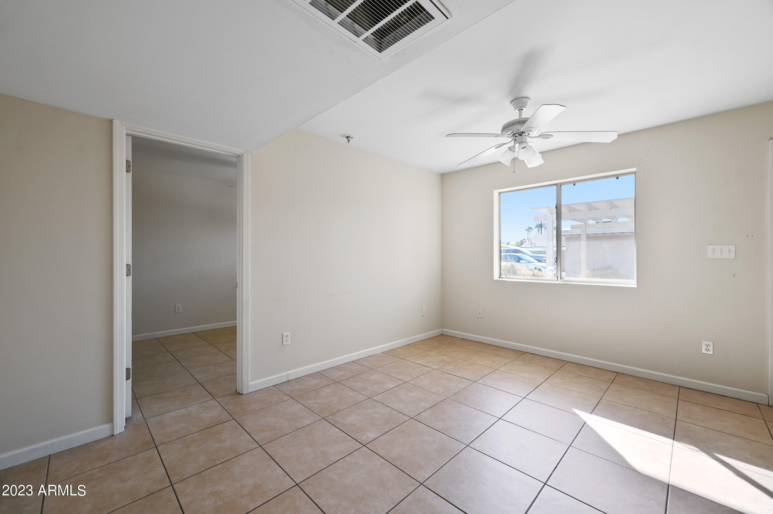 3949 East Earll Drive, Unit 4 Phoenix, AZ 85018 - Photo 8 of 11 a view of an empty room with a window