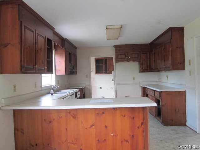 18645 Courthouse Road Dinwiddie, VA 23841 - Photo 3 of 12 a kitchen with stainless steel appliances granite countertop wooden cabinets a sink and a stove