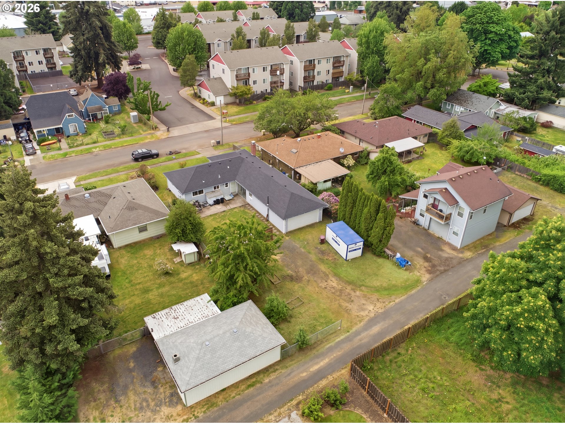 1357 Grove Street Lebanon, OR 97355 - Photo 32 of 37 an aerial view of residential houses with outdoor space and swimming pool