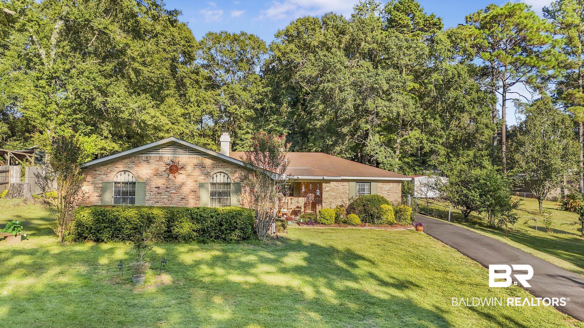 2573 E Road Mobile, AL 36693 - Photo 29 of 45 Single story home with brick siding, a front yard, and a chimney