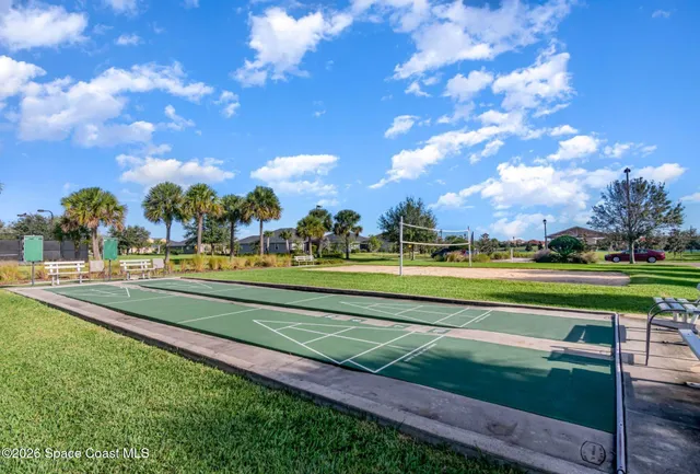 a view of swimming pool with outdoor seating