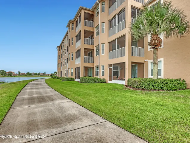 front view of building with a yard
