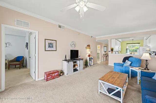a view of living room with furniture and a flat screen tv