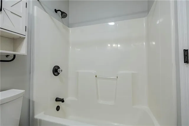 a room with a bed and a window