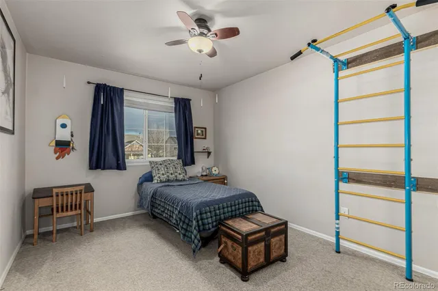 a bedroom with bed and window