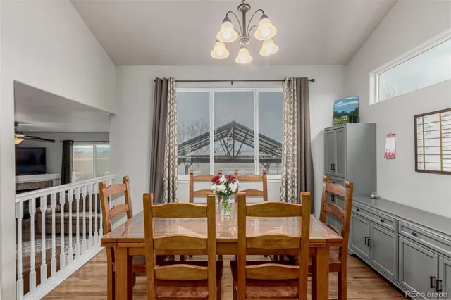 a view of a dining room with furniture window and outside view