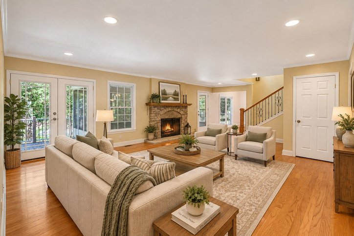 106 Pikes Ridge Anderson, SC 29626 - Photo 6 of 41 Gleaming hardwood floors and a stone fireplace anchor this warm living space with terrace access.