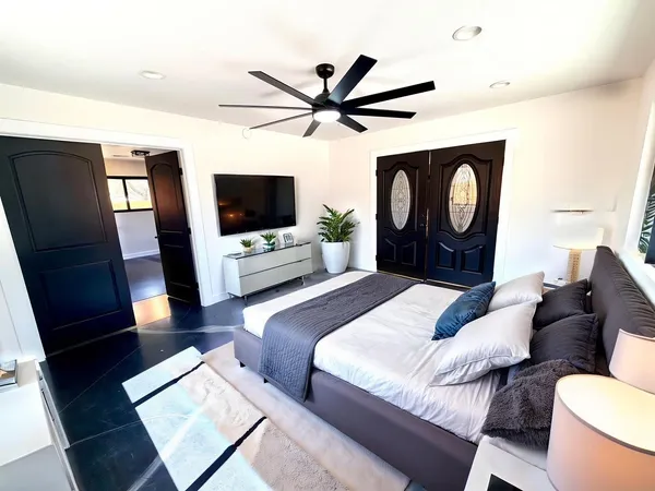 a view of an empty room and wooden floor
