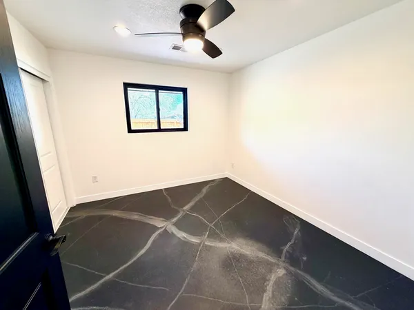 a view of a house with a yard covered in snow