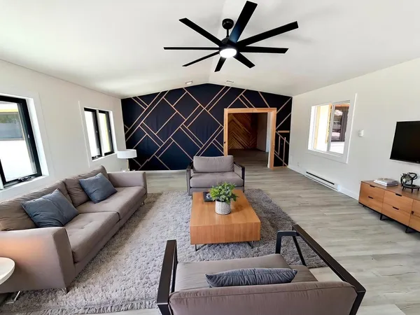a living room with furniture and a flat screen tv