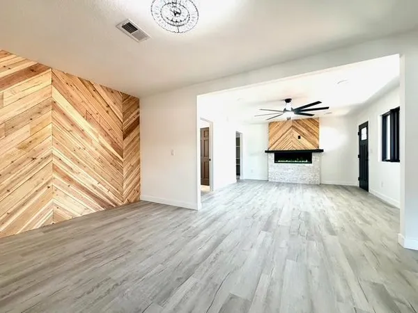 a kitchen with lots of counter top space and stainless steel appliances