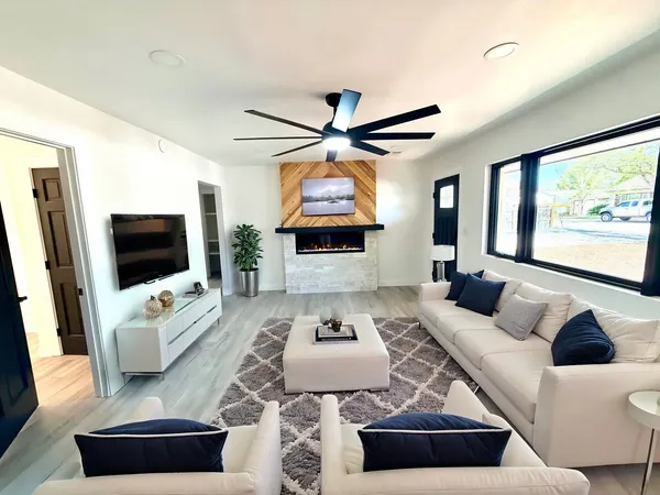 a kitchen with stainless steel appliances granite countertop white cabinets stove top oven and sink