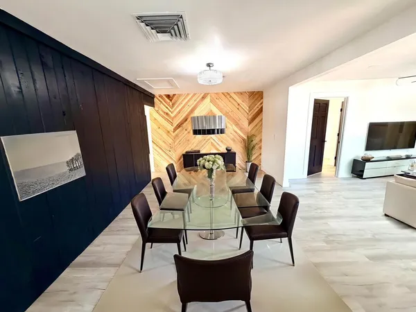 a kitchen with stainless steel appliances granite countertop a refrigerator and a stove