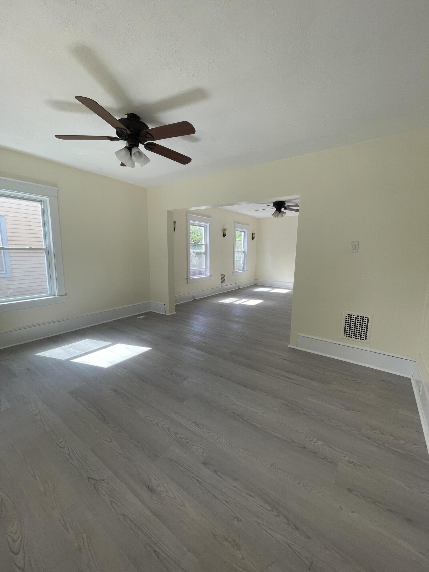 1664 West Main Street Stroudsburg, PA 18360 - Photo 11 of 29 an empty room with wooden floor and windows