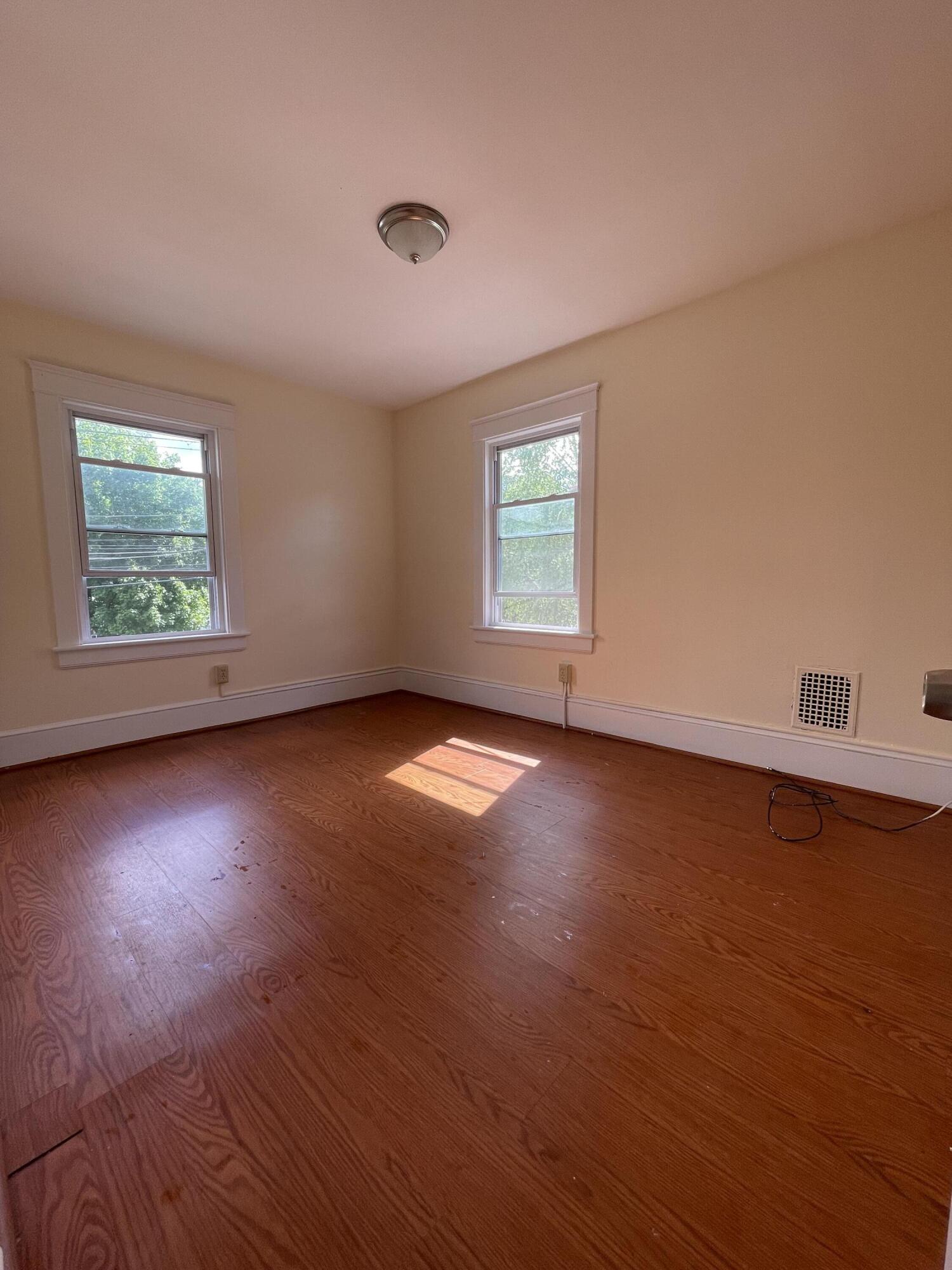 1664 West Main Street Stroudsburg, PA 18360 - Photo 22 of 29 an empty room with wooden floor and windows